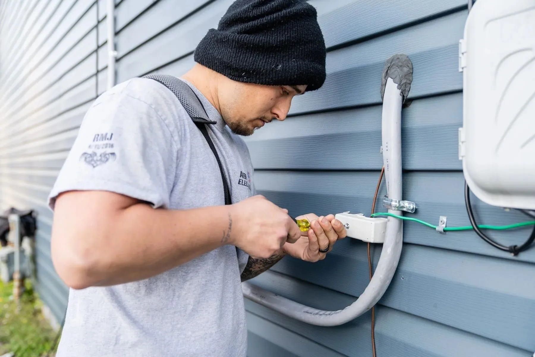 Local electric company servicing outdoor electrical connection