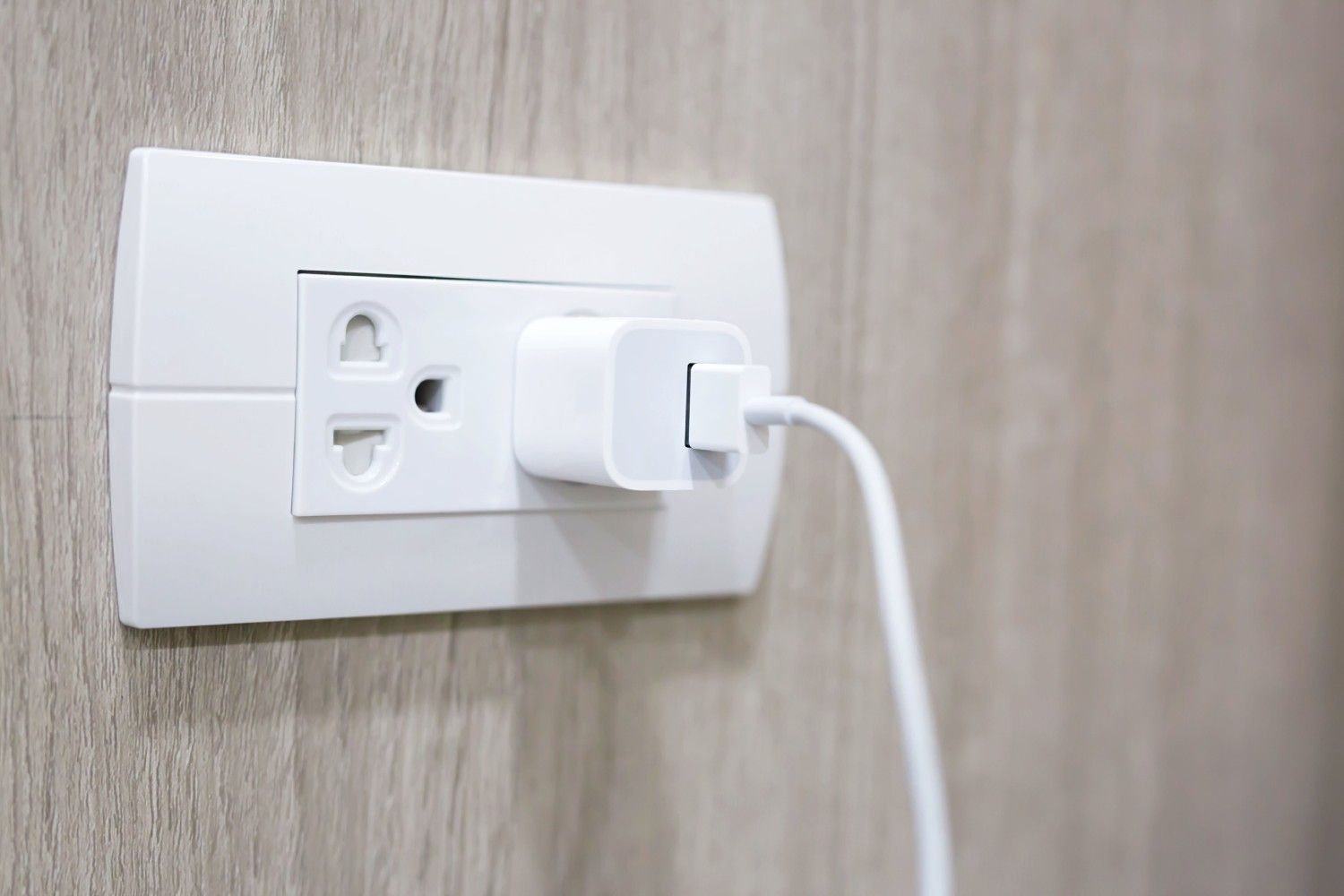 Wall outlet with charger installed in a home