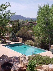 A large swimming pool with mountains in the background