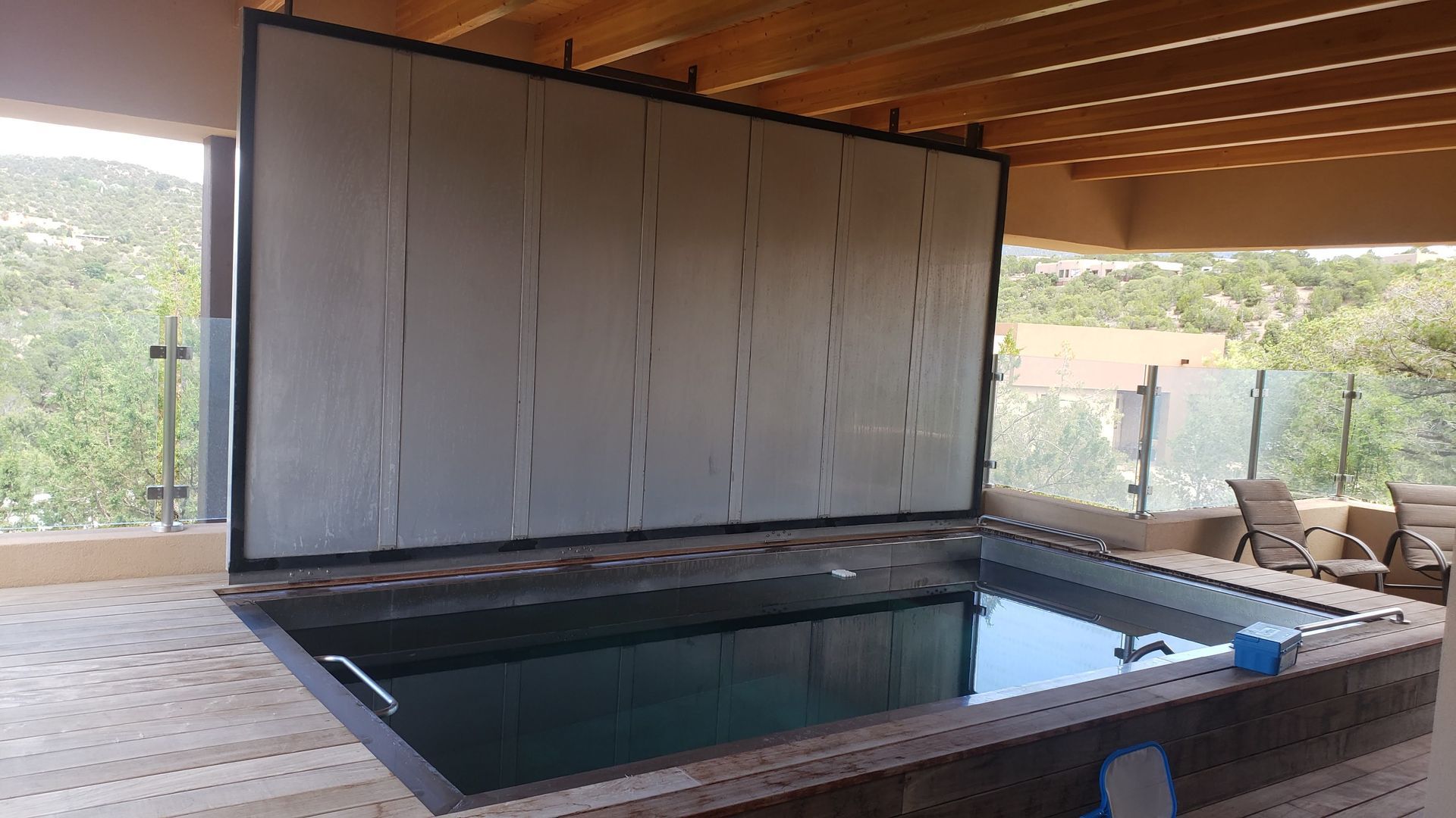 A Large Swimming Pool With a Fence Around It