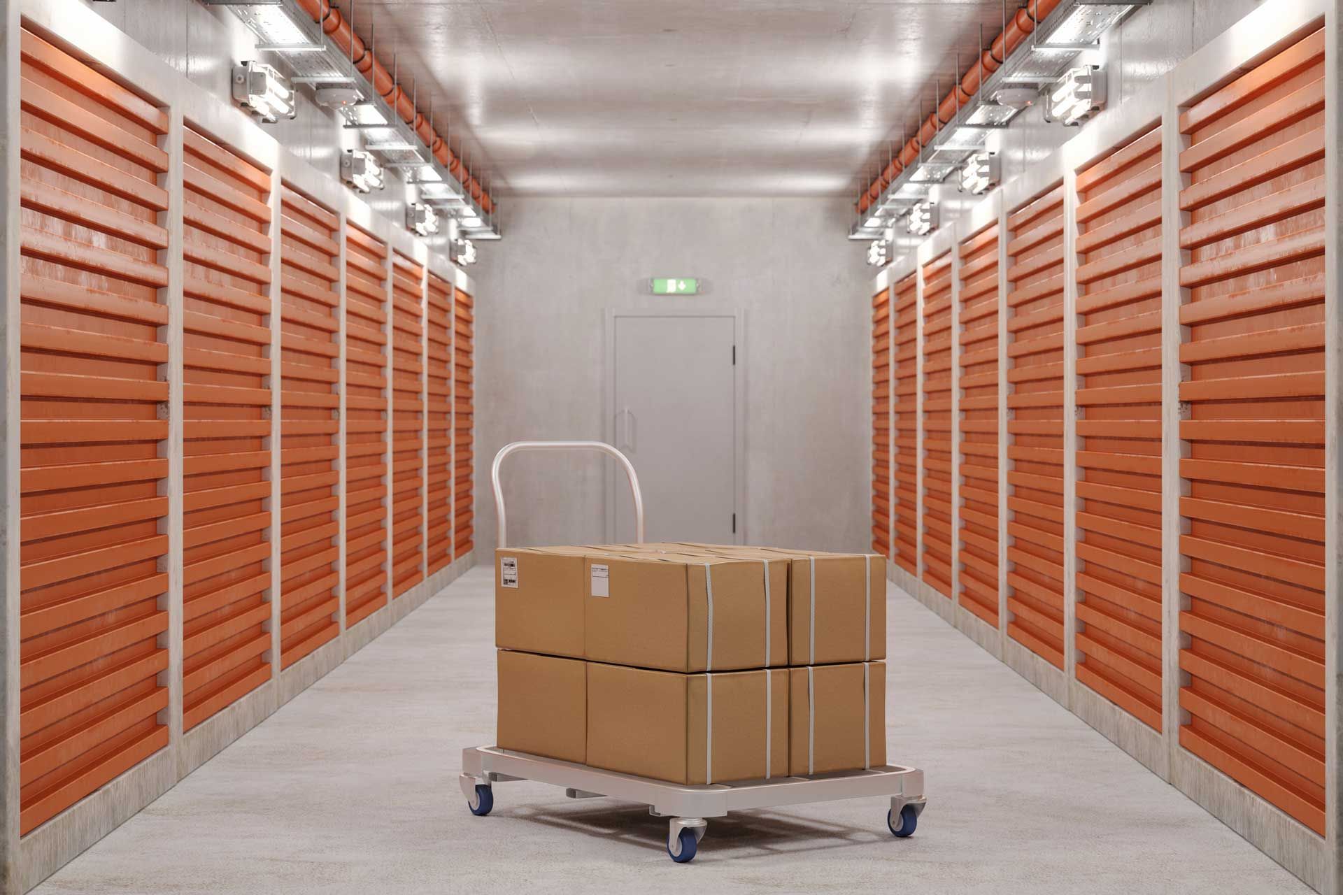 A hand truck with cardboard boxes and self-storage orange units for business storage solutions.