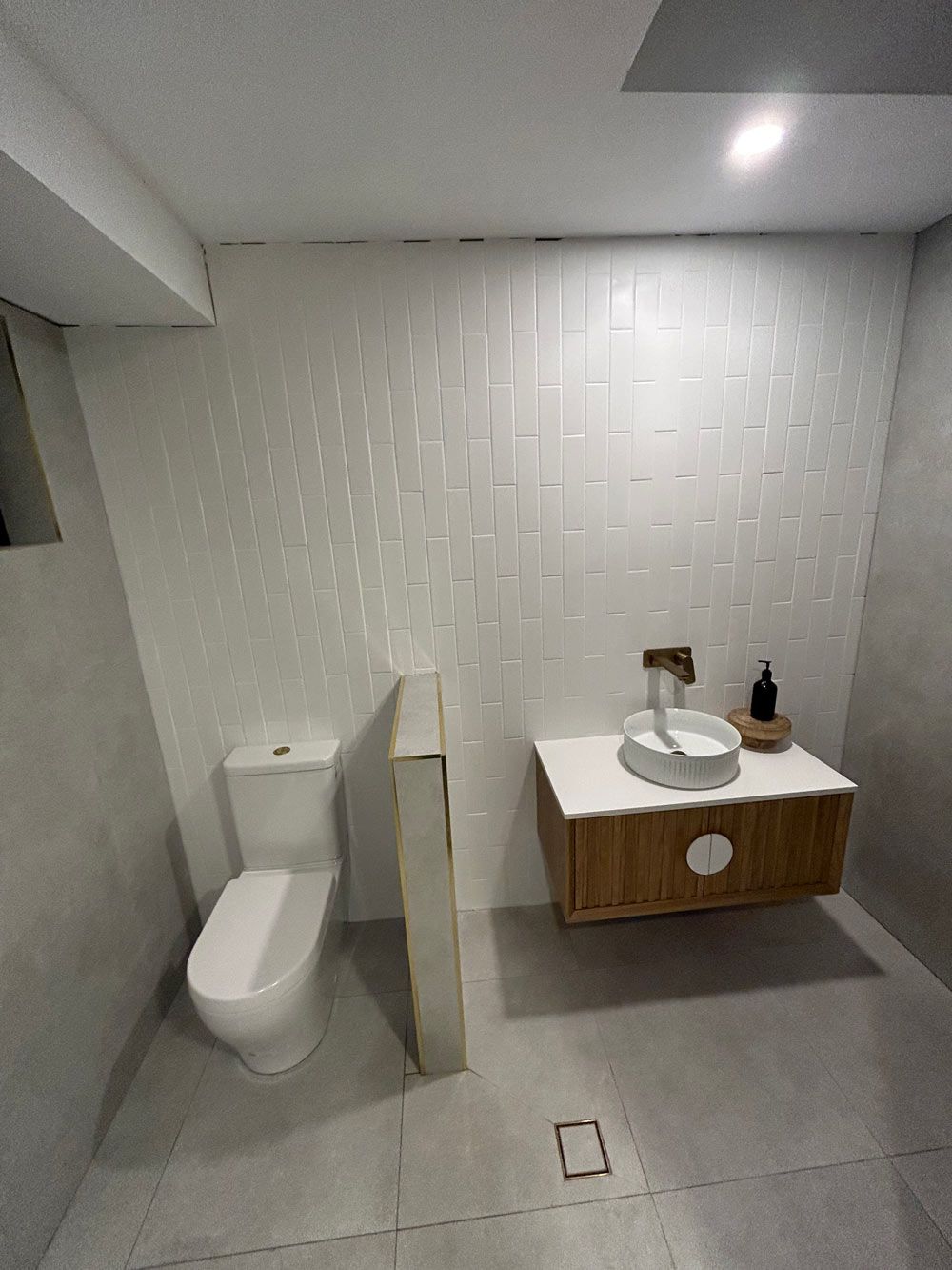 A Bathroom With A Toilet, Sink, and Shower — Professional Plumbing in Mittagong, NSW