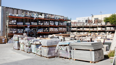 A large warehouse filled with lots of pallets and shelves