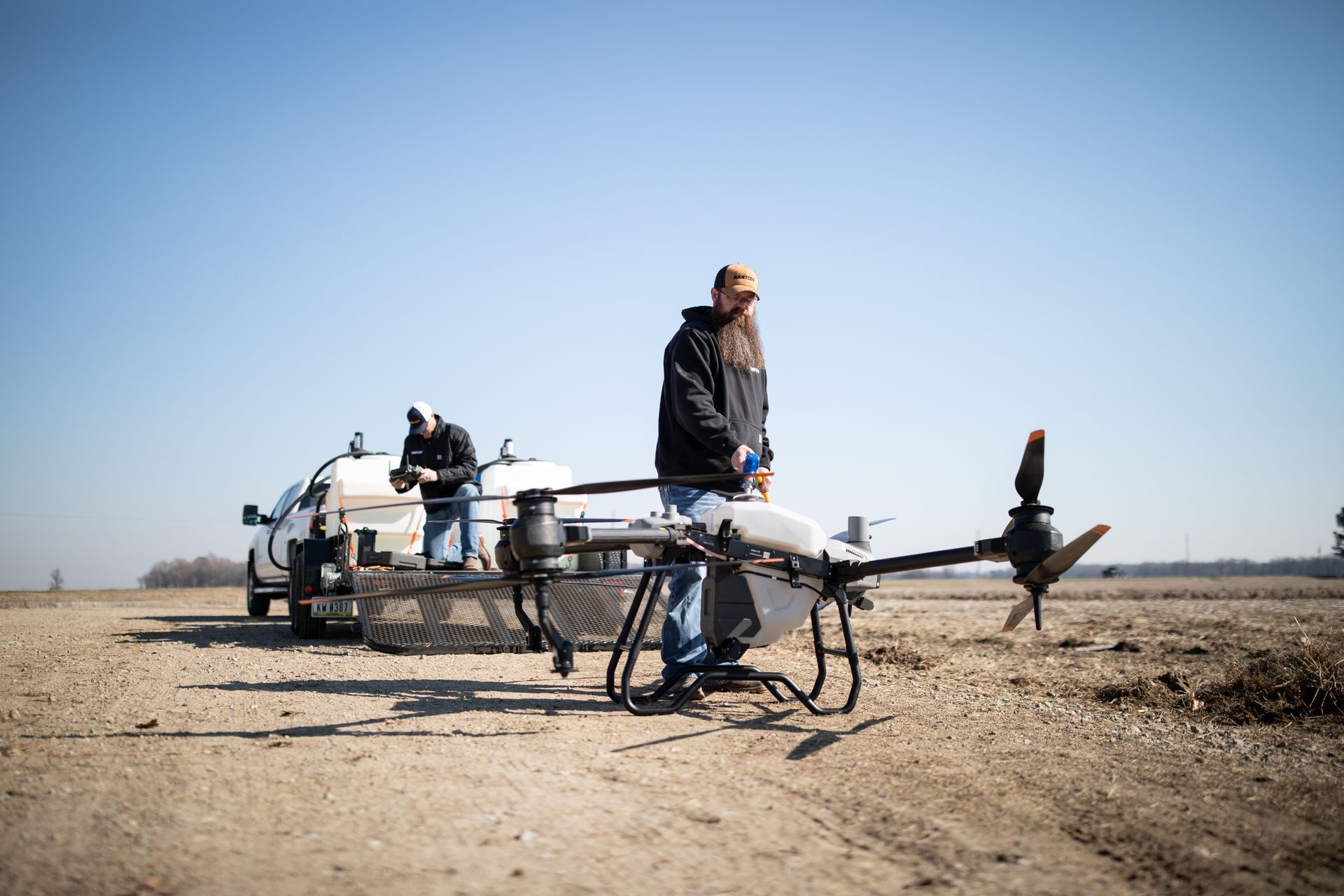 Drone operators preparing for a spray job.