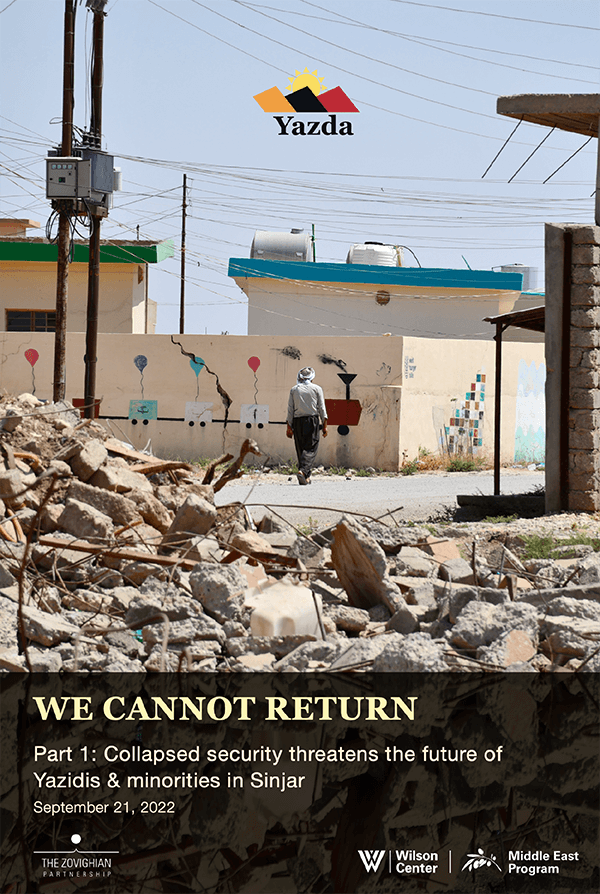 Screenshot of cover of the Part 1 Yazidi Policy paper, depicting a man behind the rubbles of damaged buildings in Sinjar