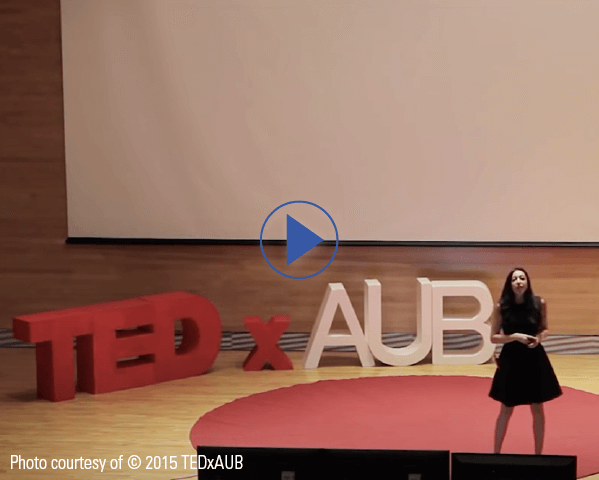 Lynn Zovighian giving a talk on TEDX AUB stage