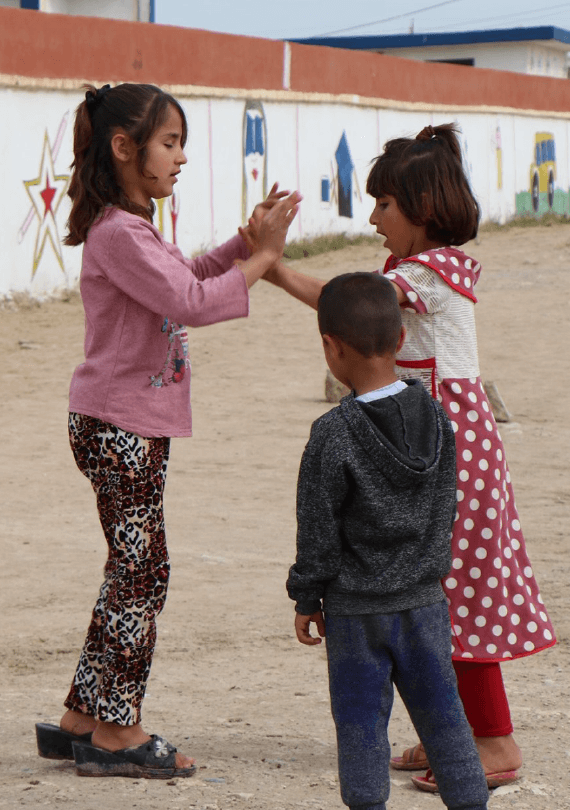 3 Yazidi children playing