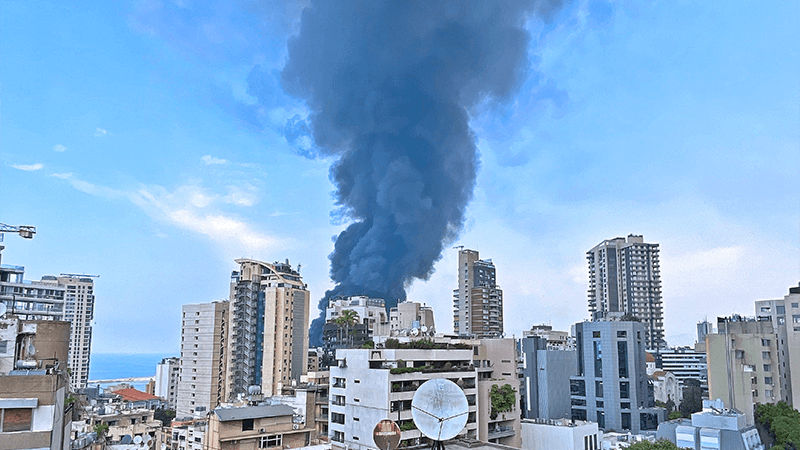 Pot of buildings in Beirut, with smoke from the Beirut Explosion