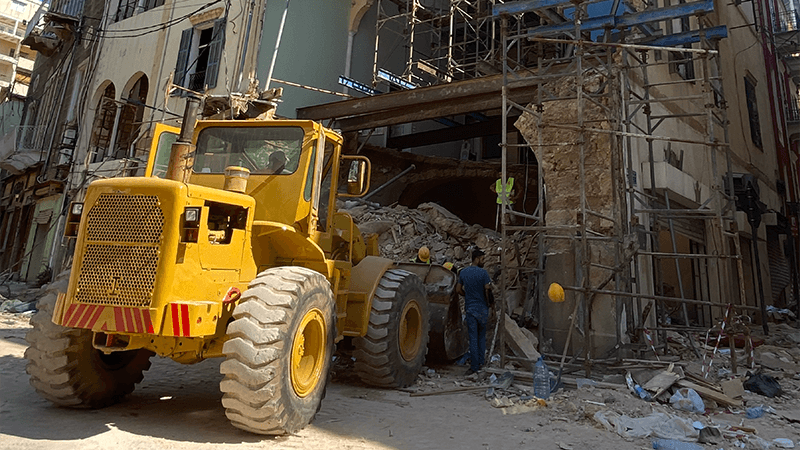 A tractor removing the rubble from a destroyed building from the Beirut Explosion