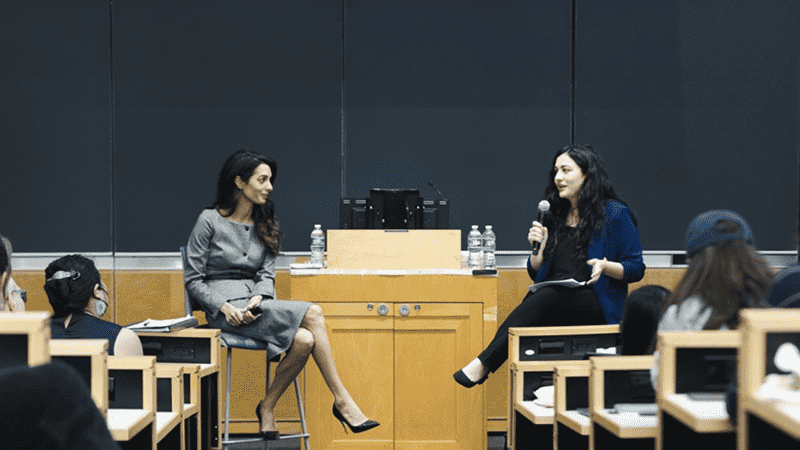 A photo of Natia and Amal Clooney at Columbia Law School