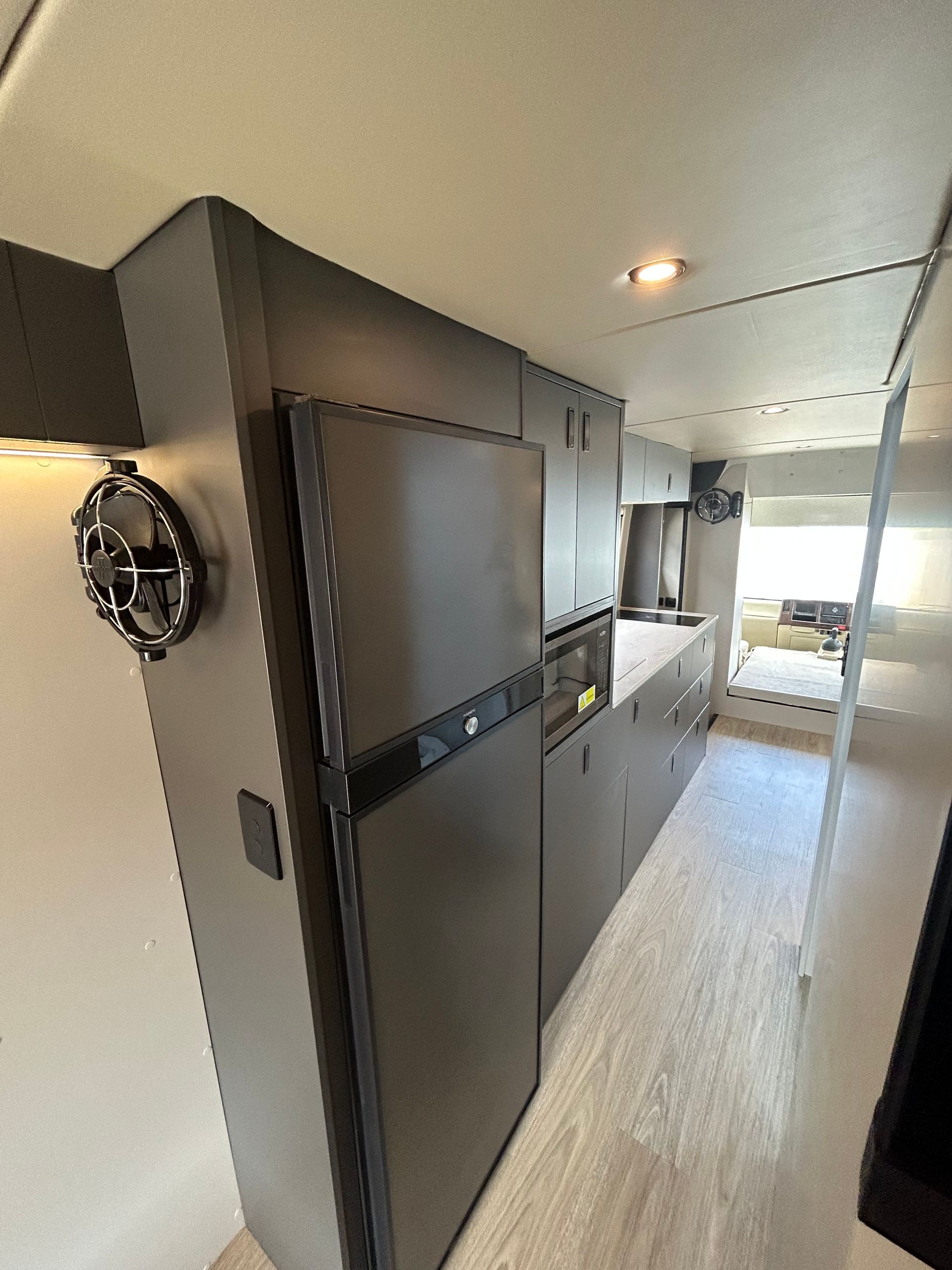 A Van With The Door Open And A Bed In The Back — Live Unbound Campers In Upper Coomera, QLD