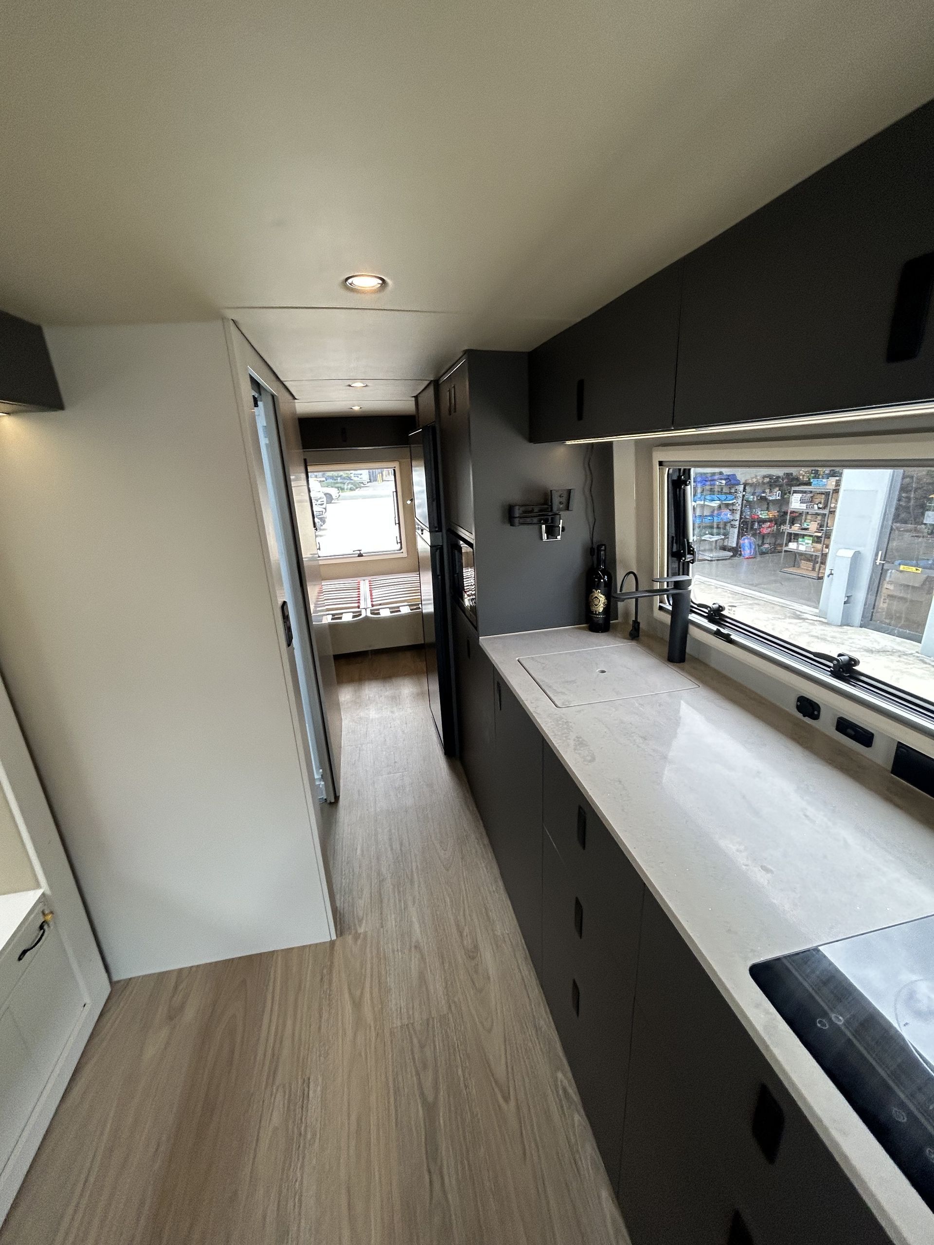 A Wooden Table Is Sitting In The Back Of A Car — Live Unbound Campers In Upper Coomera, QLD