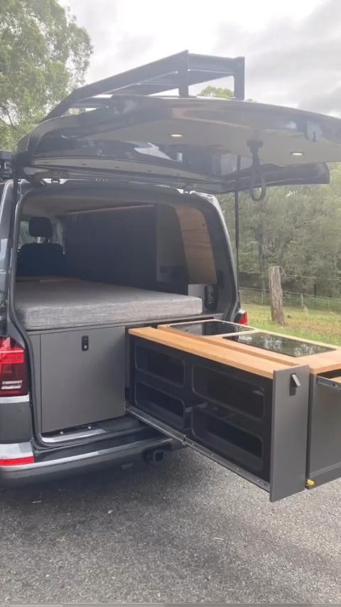 A Van With The Back Door Open And A Bed In The Back — Live Unbound Campers In Upper Coomera, QLD