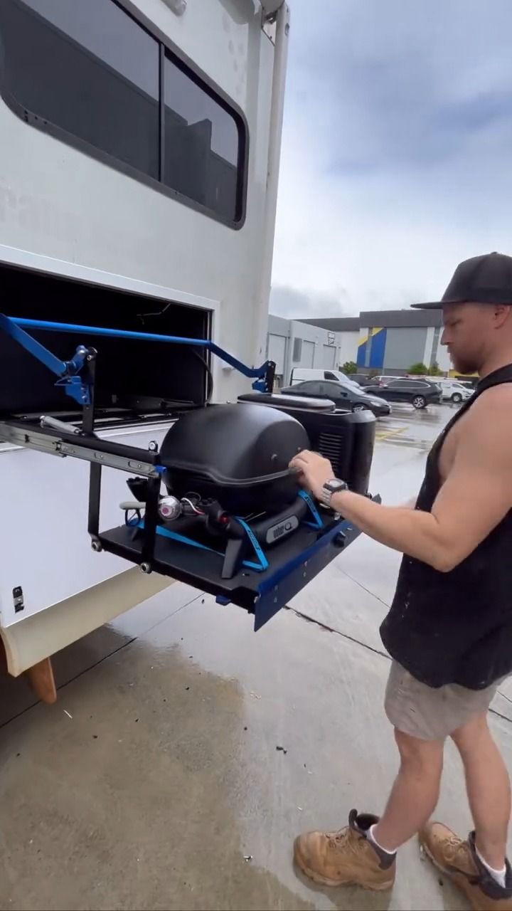 Two White Vans Are Parked In A Garage With A Ladder — Live Unbound Campers In Upper Coomera, QLD