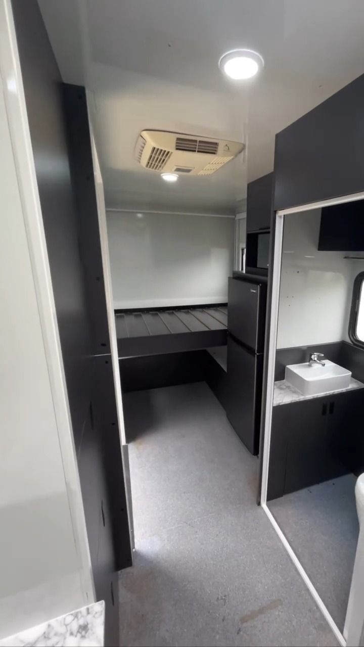 A Hallway In A Camper With A Sink And A Refrigerator — Live Unbound Campers In Upper Coomera, QLD