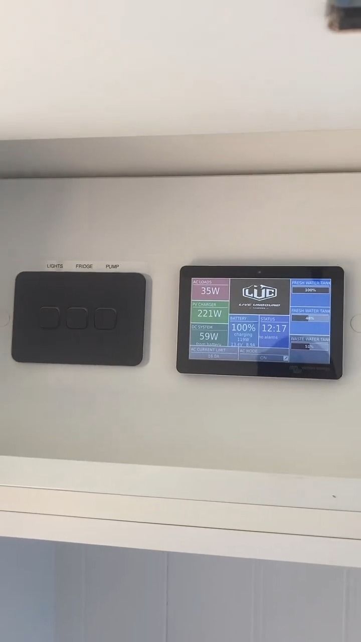 A Tablet Is Hanging On A Wall Next To A Power Outlet — Live Unbound Campers In Upper Coomera, QLD