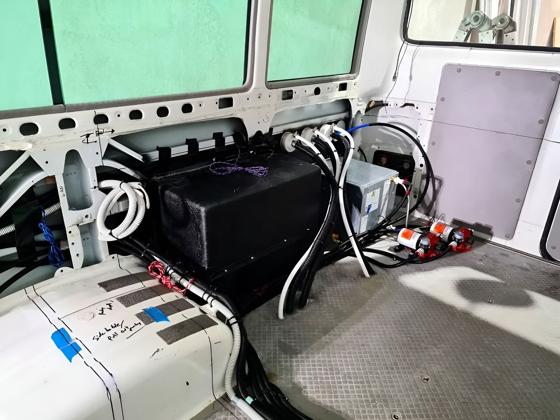 The Inside Of A Van With A Bunch Of Wires Coming Out Of It — Live Unbound Campers In Upper Coomera, QLD
