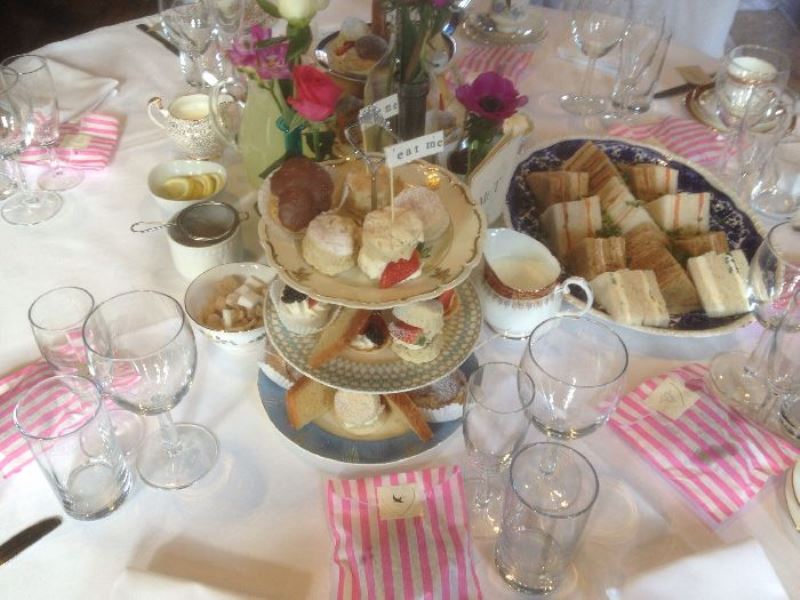 Stand with cakes and sandwiches