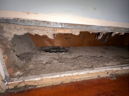 Dusty air vent with accumulated debris and grime.