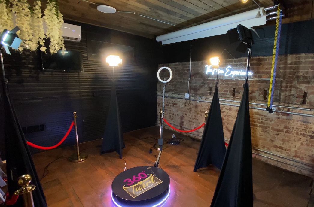 There is a photo booth in the middle of the room.