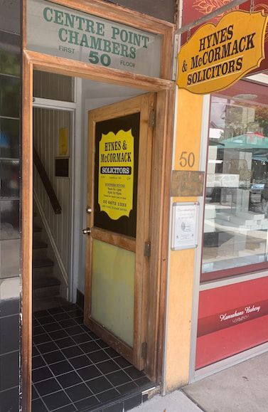 A Building With a Sign That Says Centre Point Chambers — Hynes & McCormack In Murwillumbah, NSW