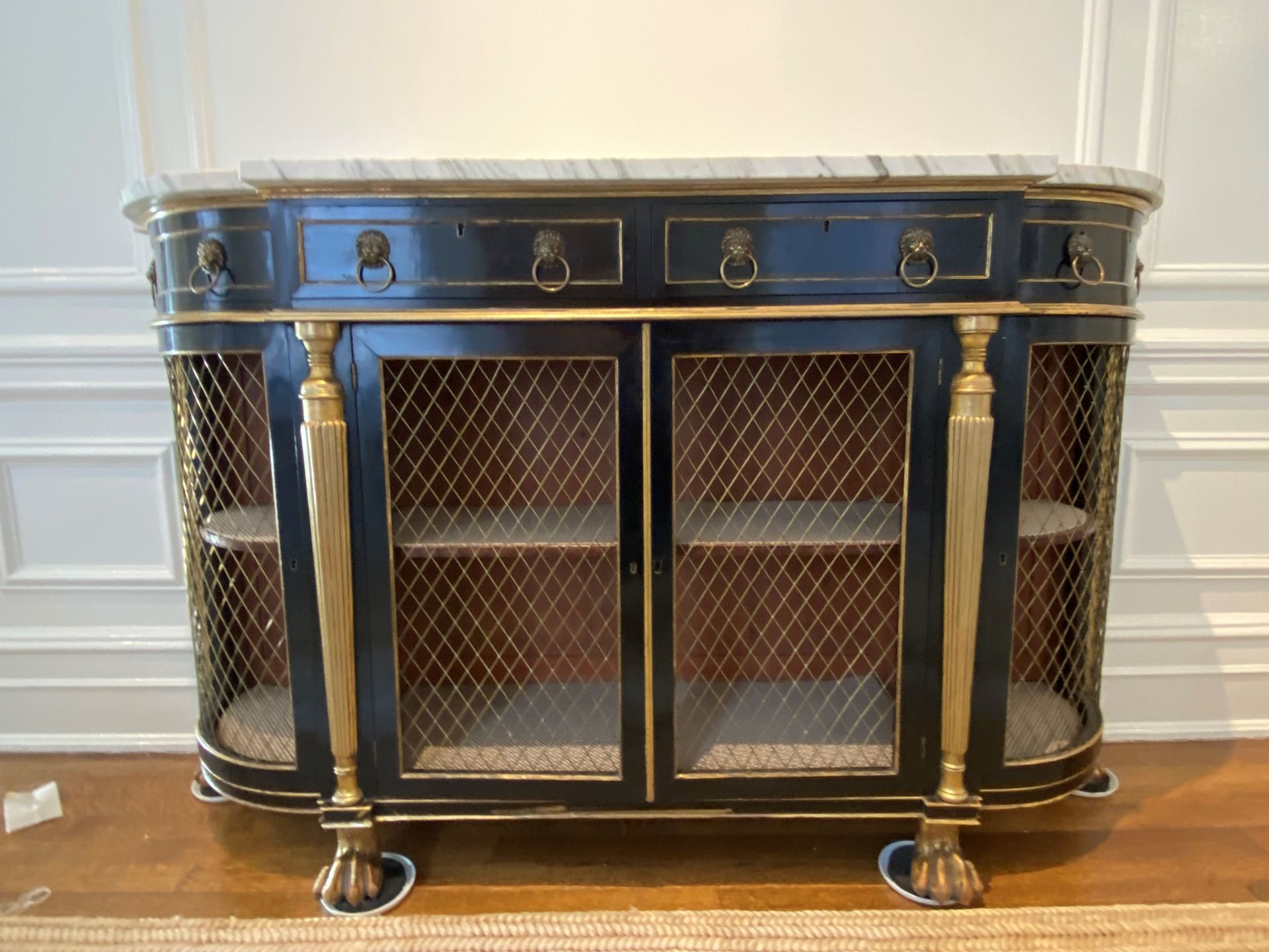 Two men are painting a room in an office.