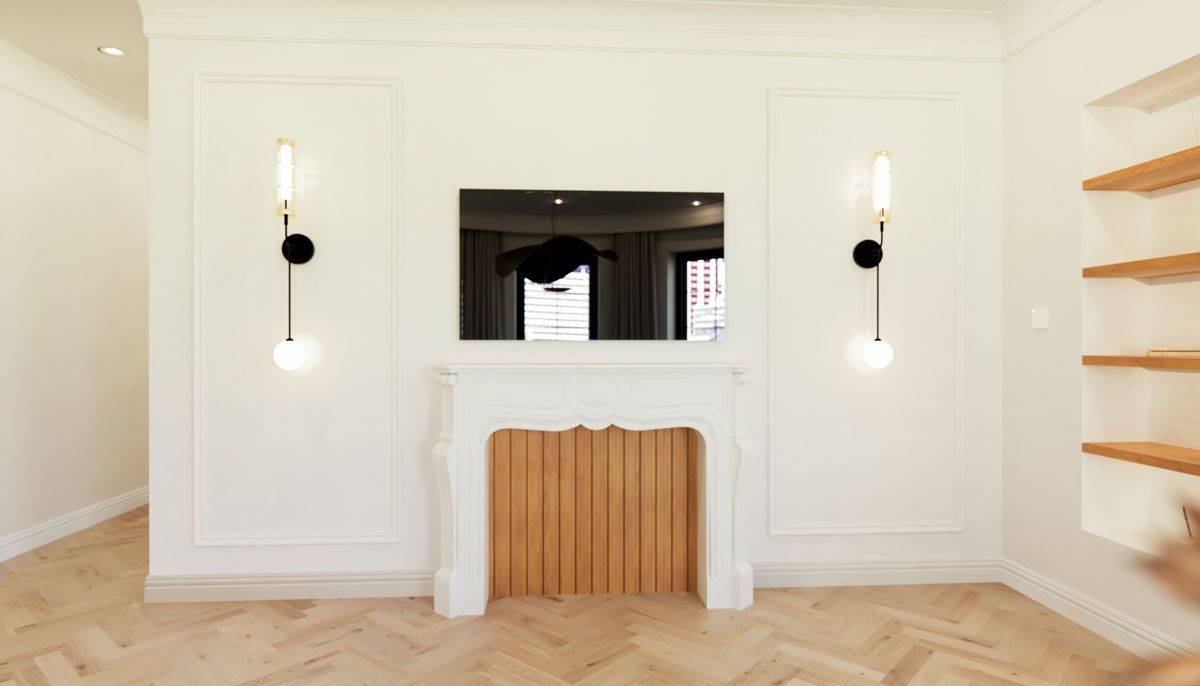 A living room with a fireplace and a flat screen tv.
