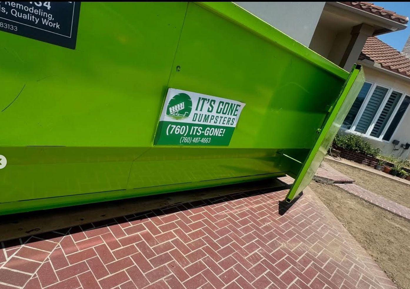 A green dumpster that says it 's core on it