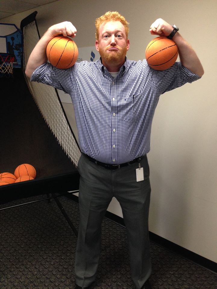 Internet Marketing Company Staff Member with 2 Basketballs