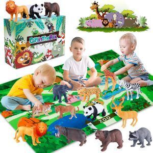 Two children are playing with zoo animals on a mat.
