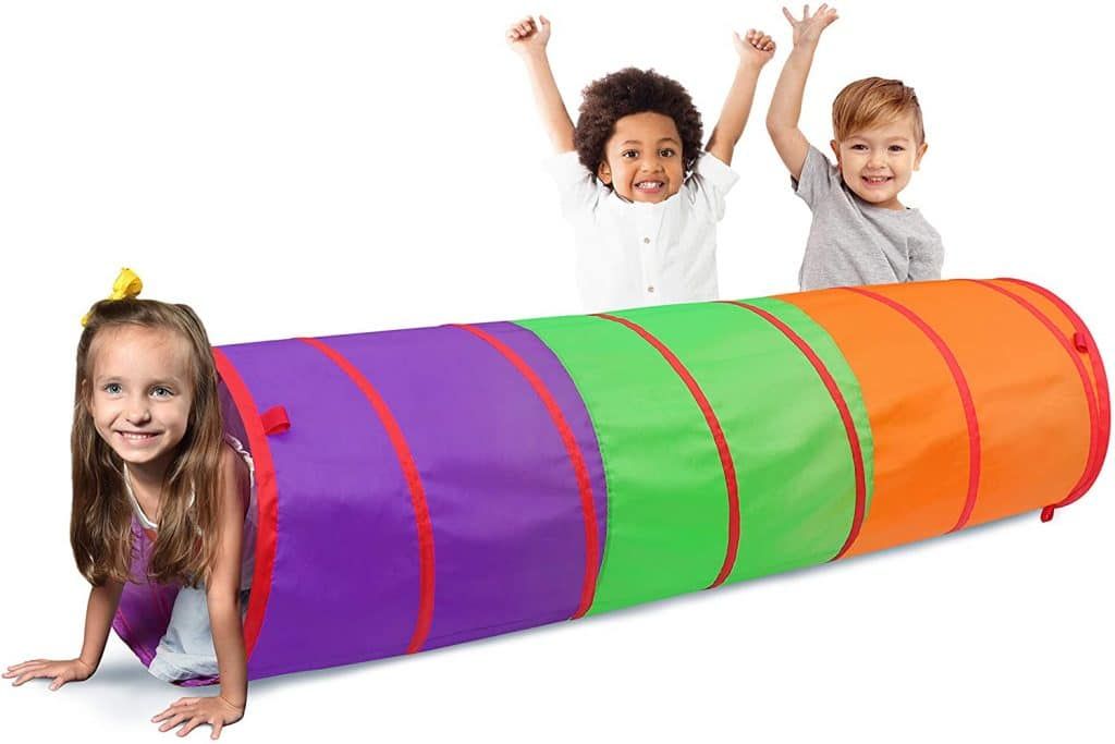 Three children are playing in a colorful tunnel.