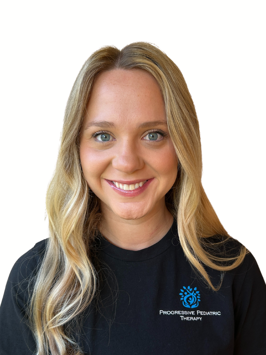 A woman with long blonde hair is wearing a black shirt and smiling.