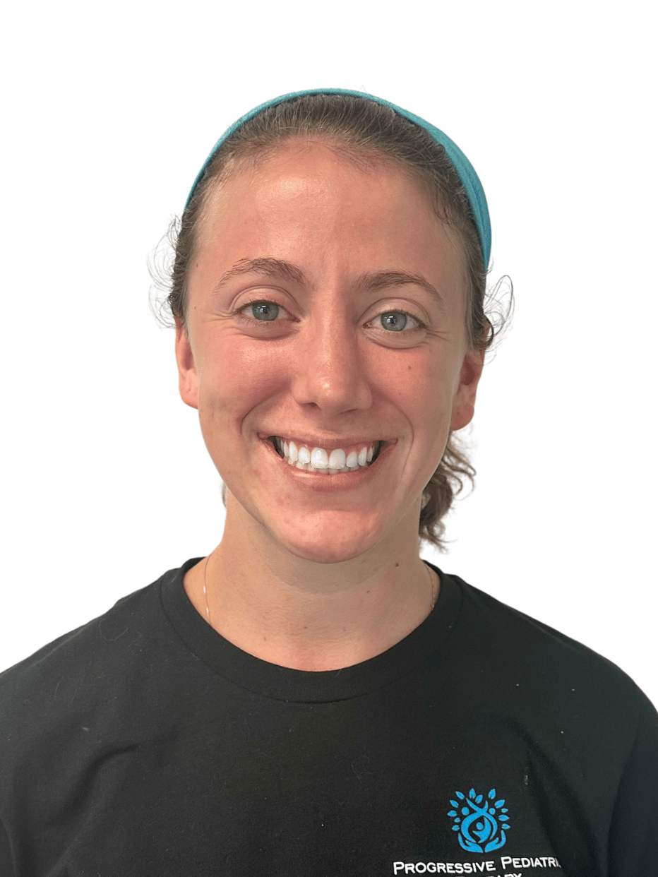 A woman wearing a black shirt and a blue headband is smiling.