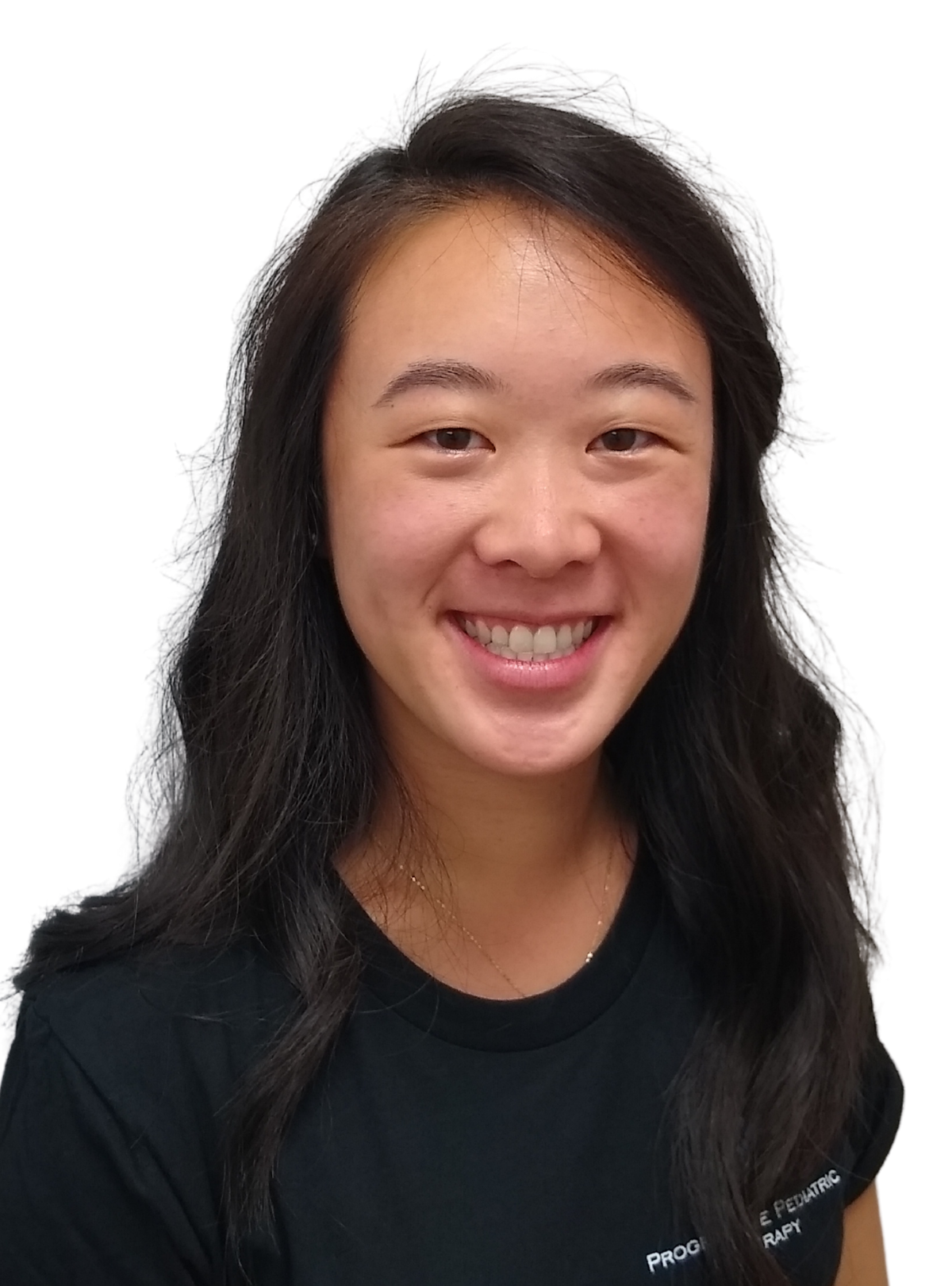 A woman wearing a black shirt is smiling for the camera