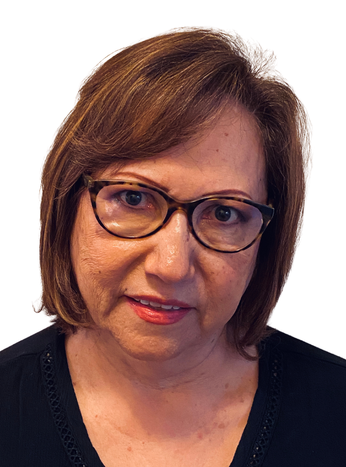 A woman wearing glasses and a black sweater is smiling for the camera.