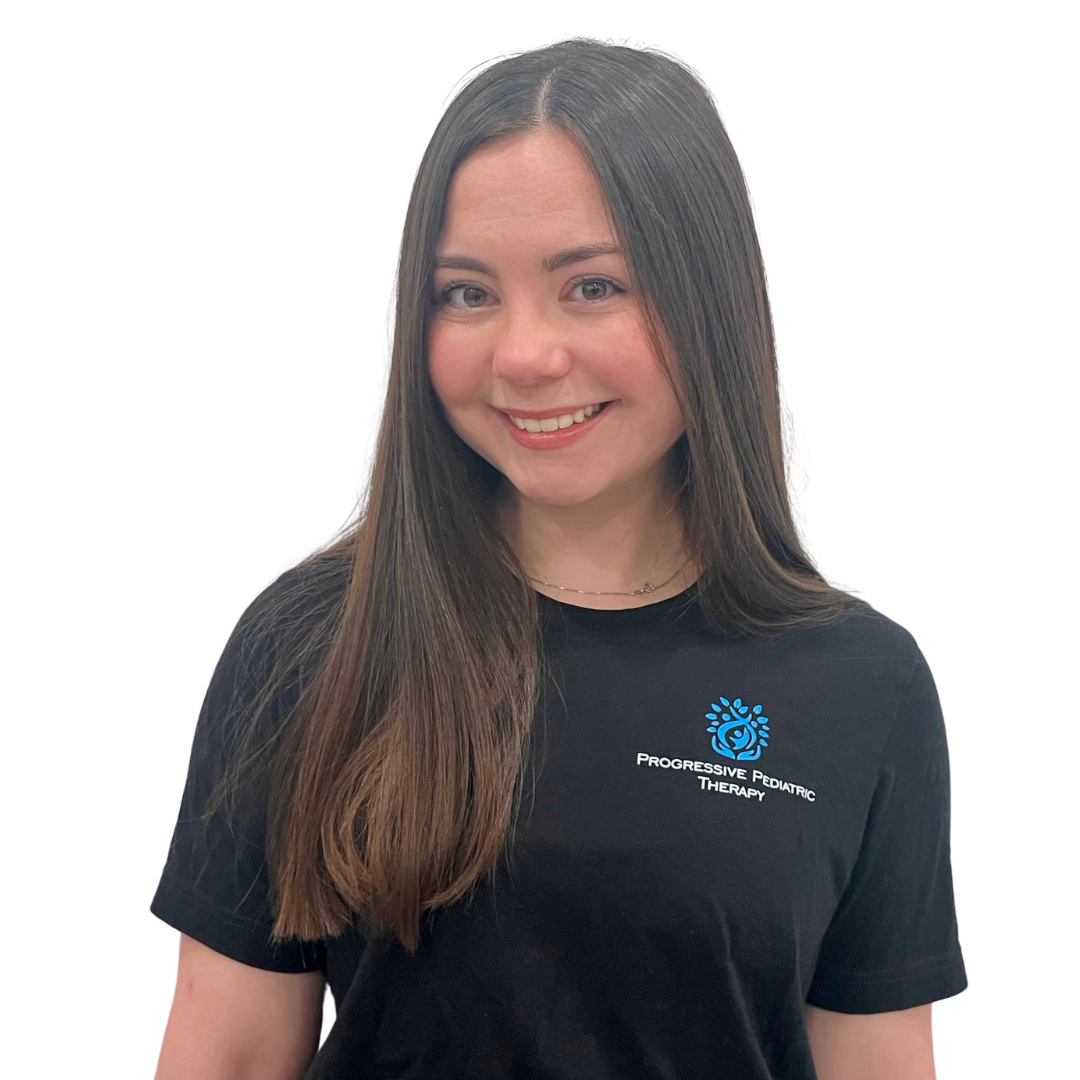 A woman with dreadlocks is smiling and wearing a black shirt.