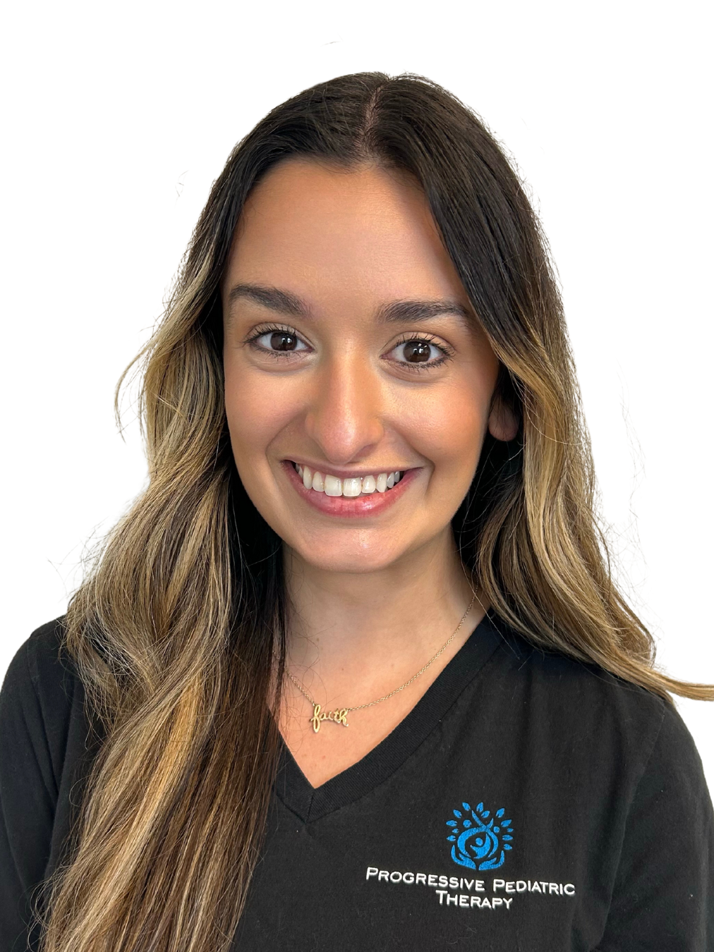 A woman in a black shirt is smiling for the camera.
