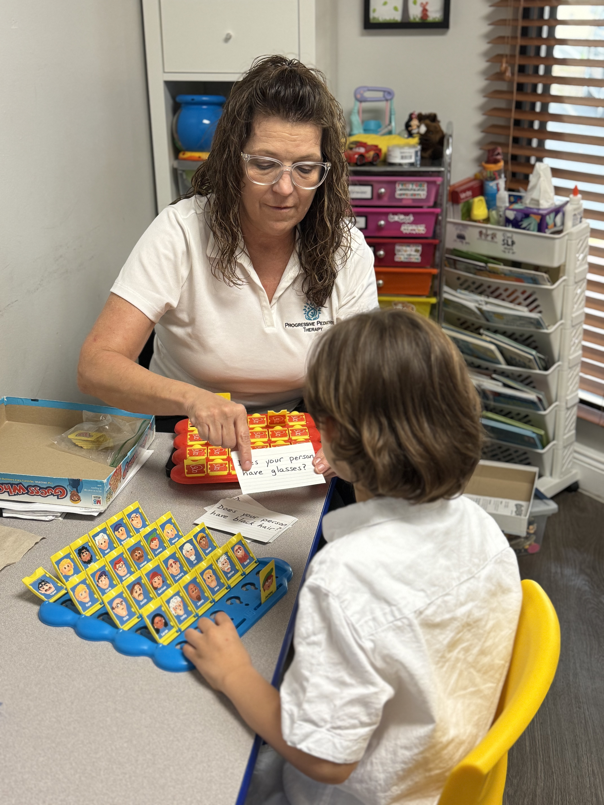 A woman is playing a game with a child.