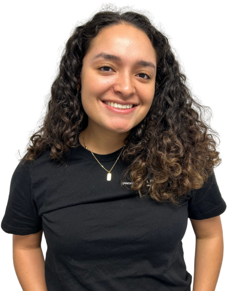 A woman with long brown hair is wearing a black shirt and smiling.