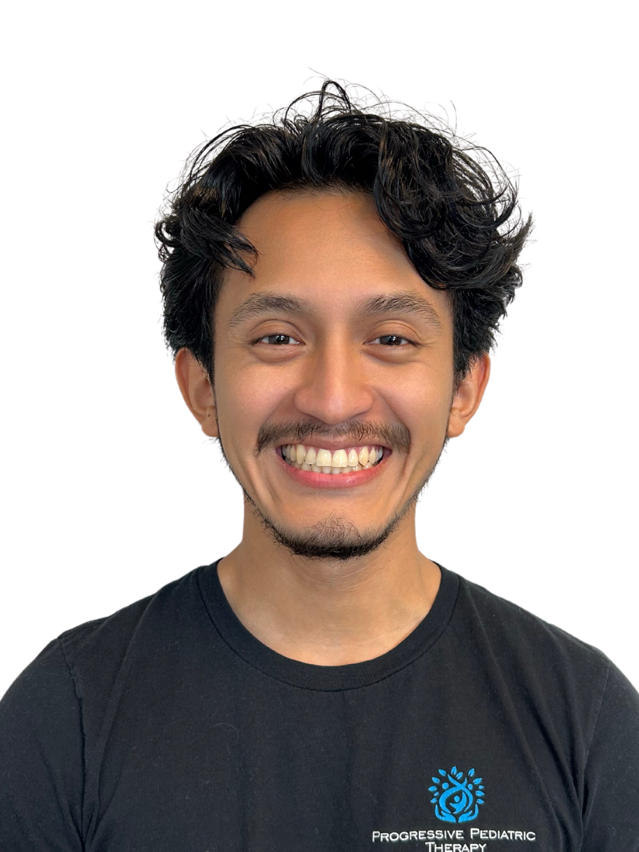 A man with a beard is smiling for the camera while wearing a black shirt.