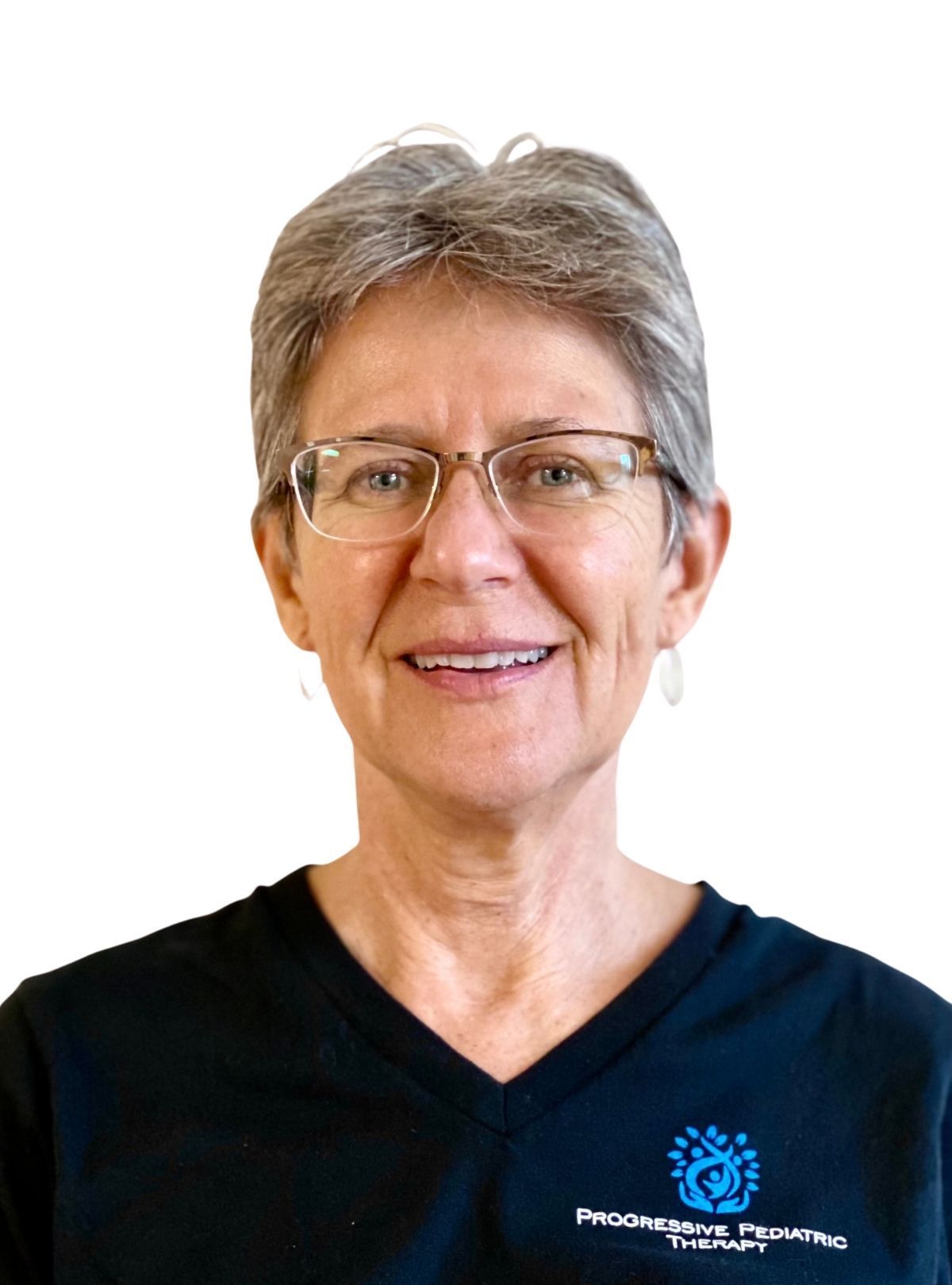 A woman wearing glasses and a black shirt is smiling for the camera.