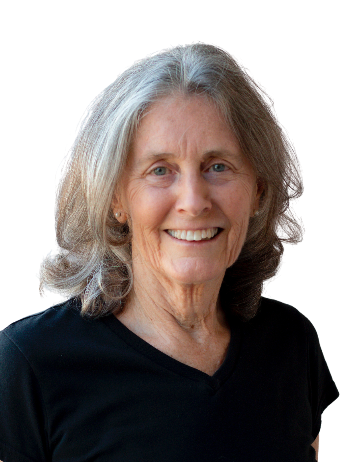 A woman with gray hair is wearing a black shirt and smiling.