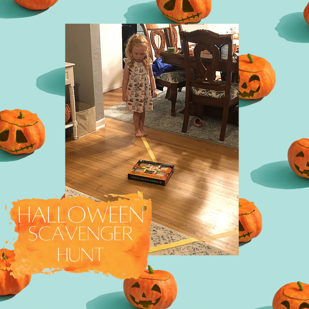A little girl is playing a halloween scavenger hunt