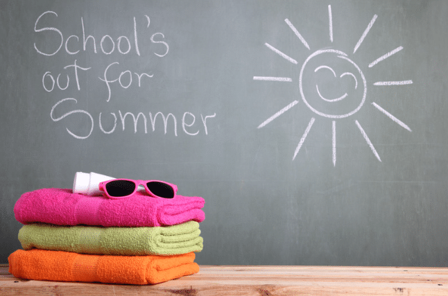 A chalkboard with the words school 's out for summer written on it
