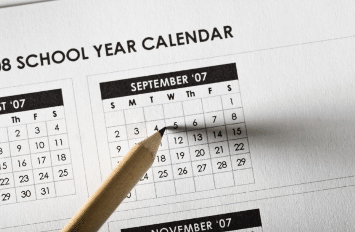A school year calendar with a pencil on it