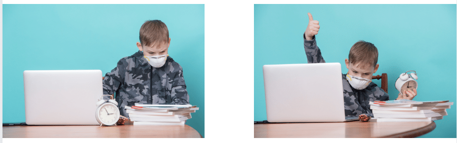 A boy wearing a mask is sitting at a desk in front of a laptop computer.