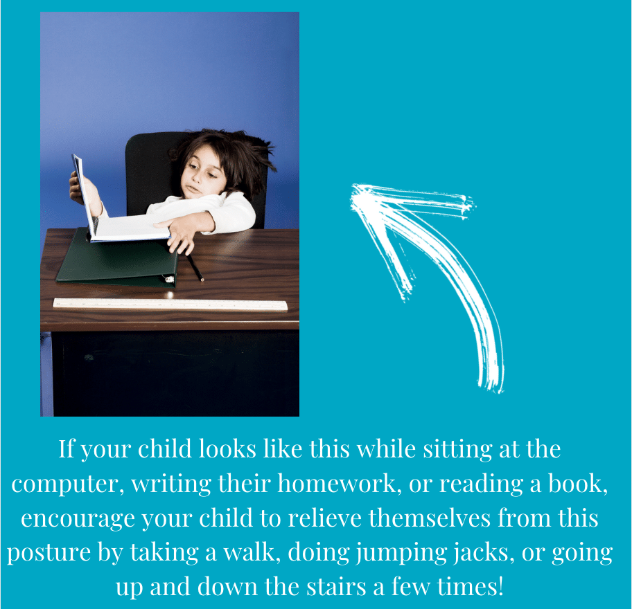 A child is sitting at a desk reading a book