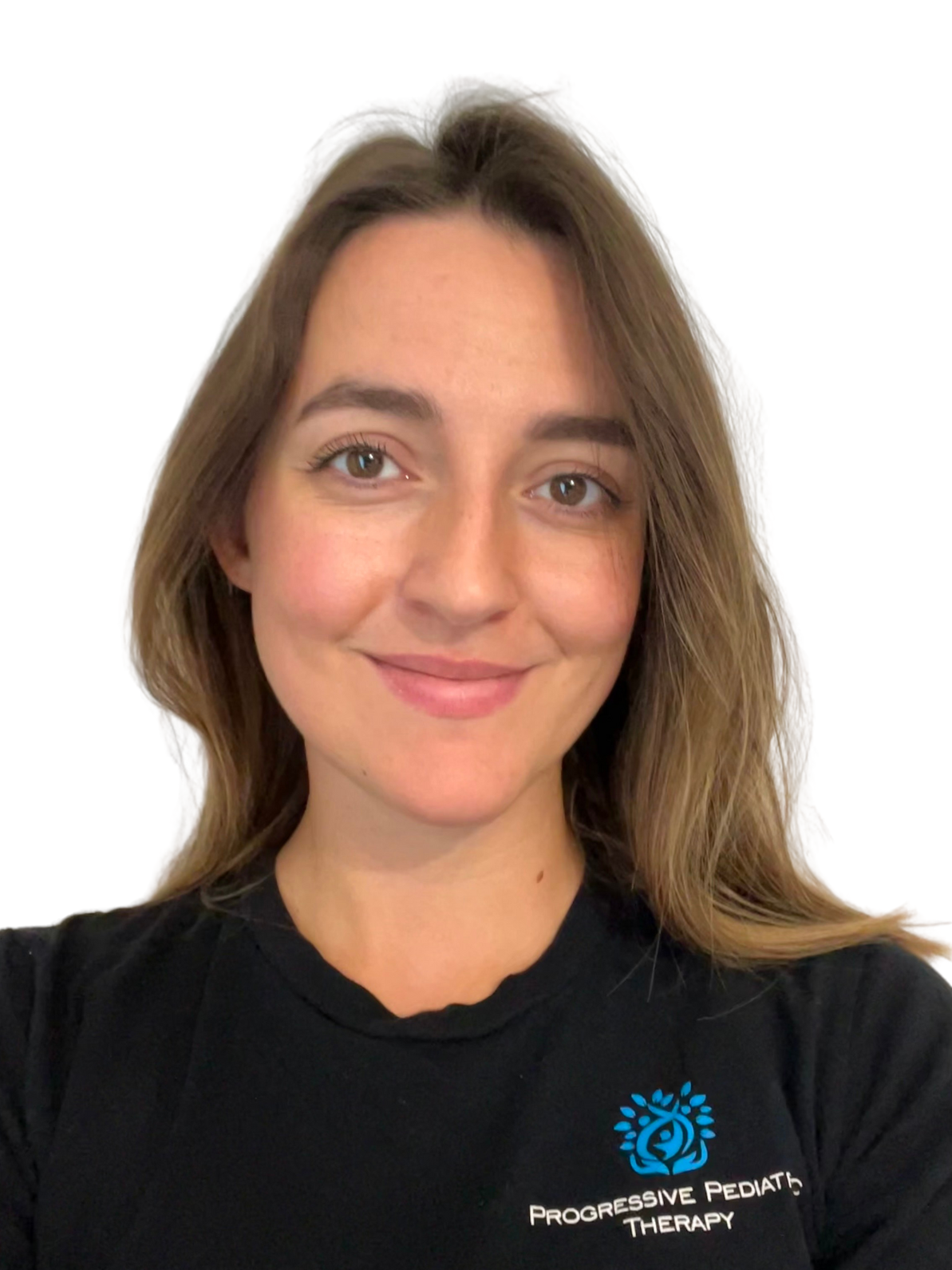 A woman wearing a black t-shirt with a logo on it is smiling for the camera.