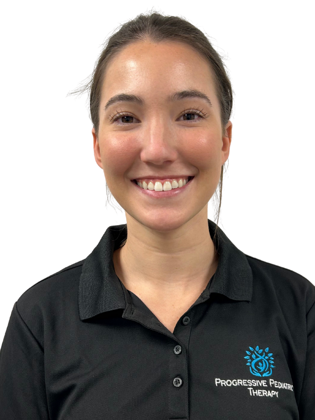 A woman wearing a black t-shirt with a logo on it is smiling for the camera.