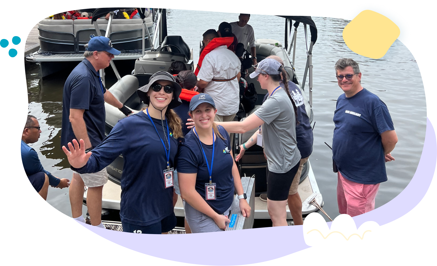 A group of people are standing on a boat in the water.